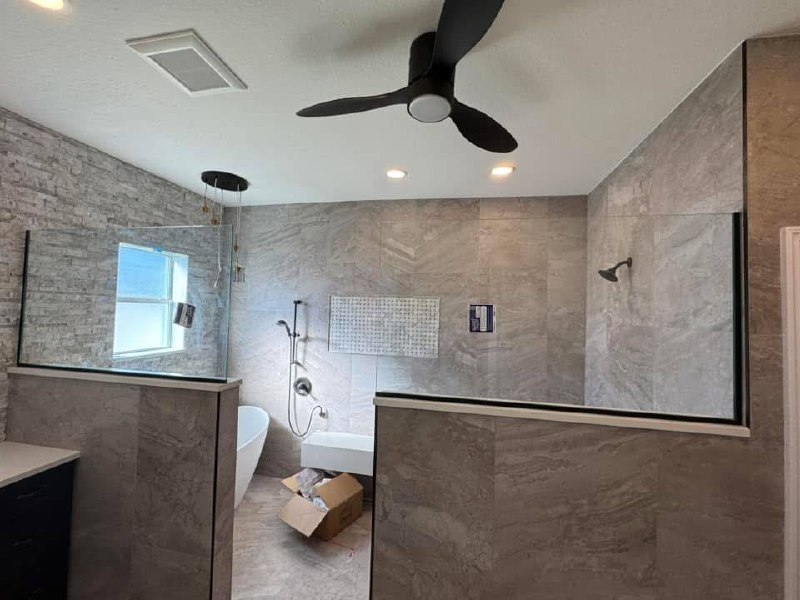 Half wall shower with stone tile