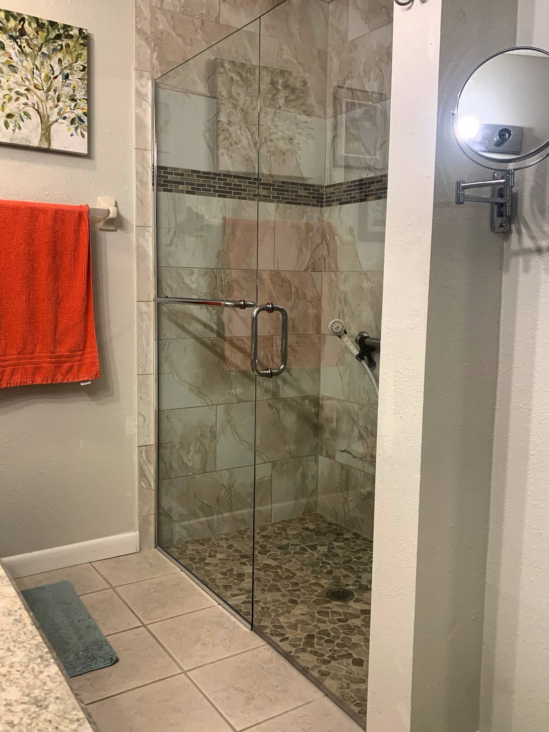 Inline shower with pebble floor