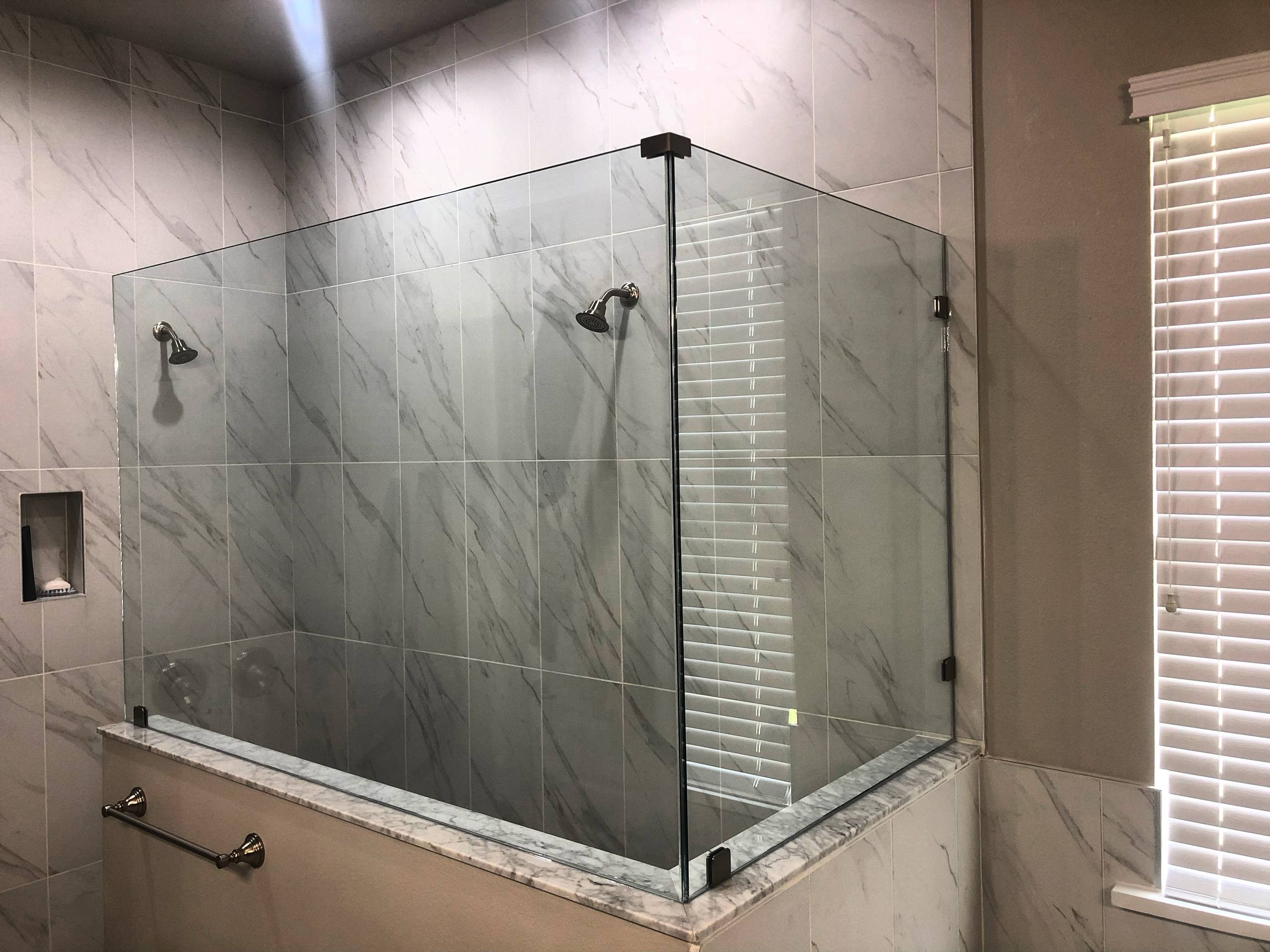 Tub enclosure with marble and matte black